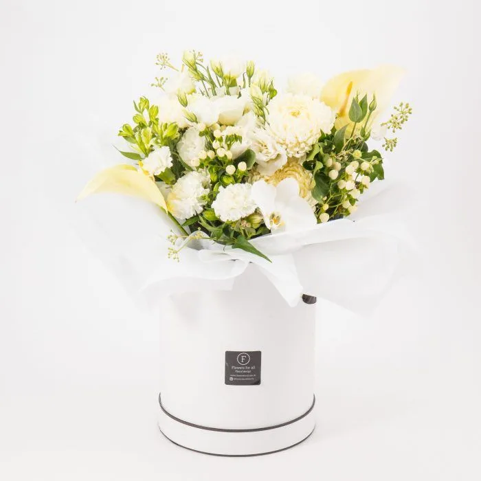 All-white bloom box with calla, lisianthus and carnation in a white round hat box with studio F-tag — White Blooms Hat Box